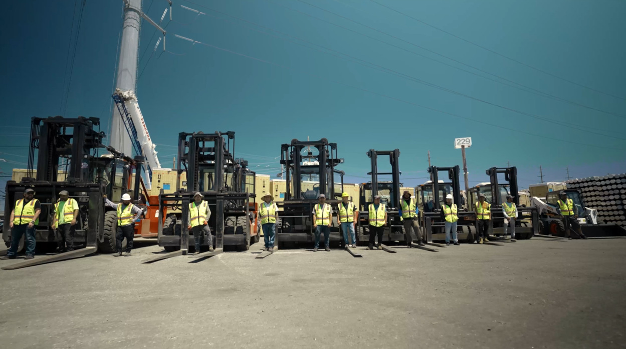 Eastern Terminals crew lined up in front of our heavy-duty forklifts
